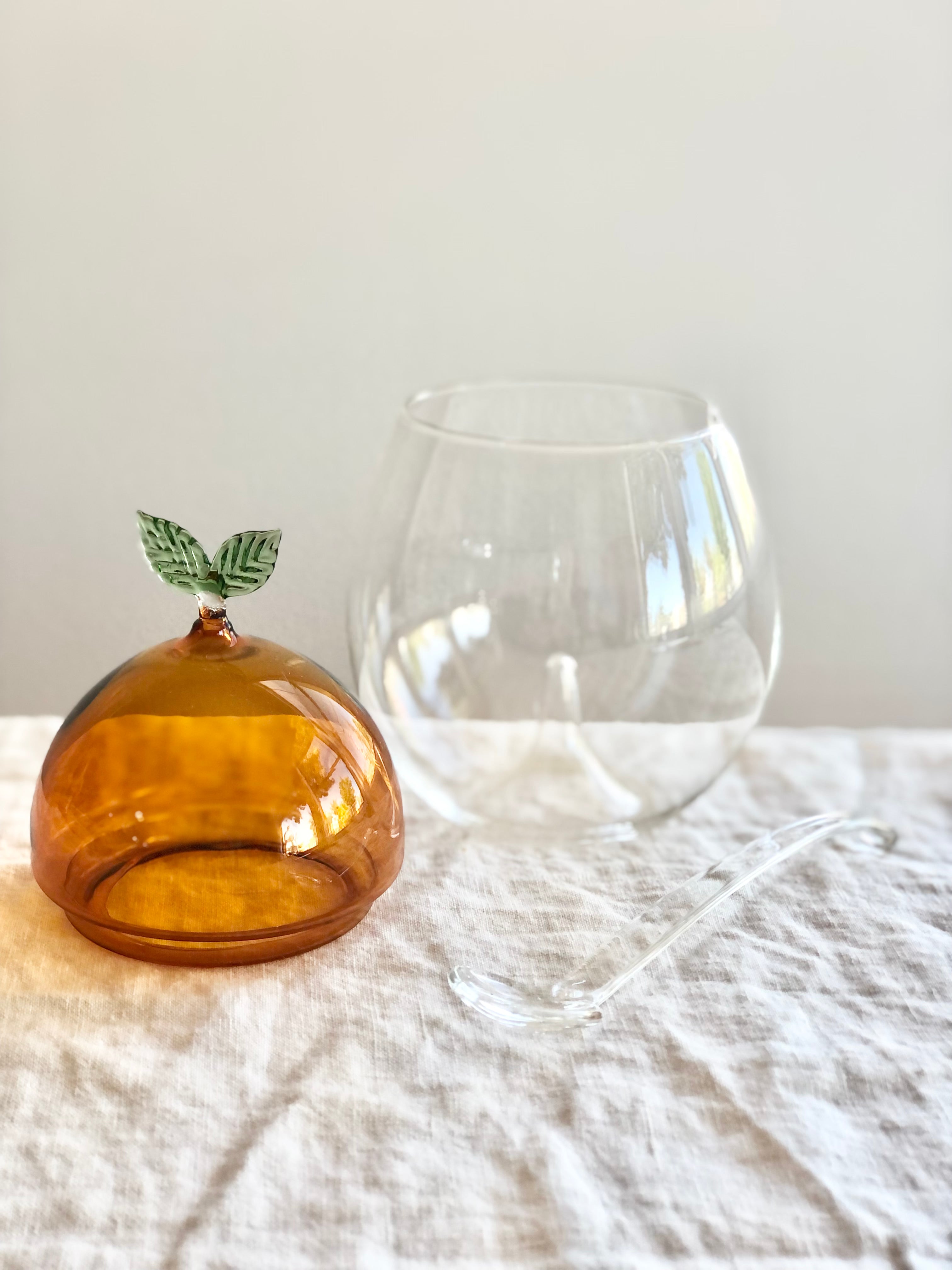 Venetian Glass Peach Jam Pot with lid and bowl shown on a table