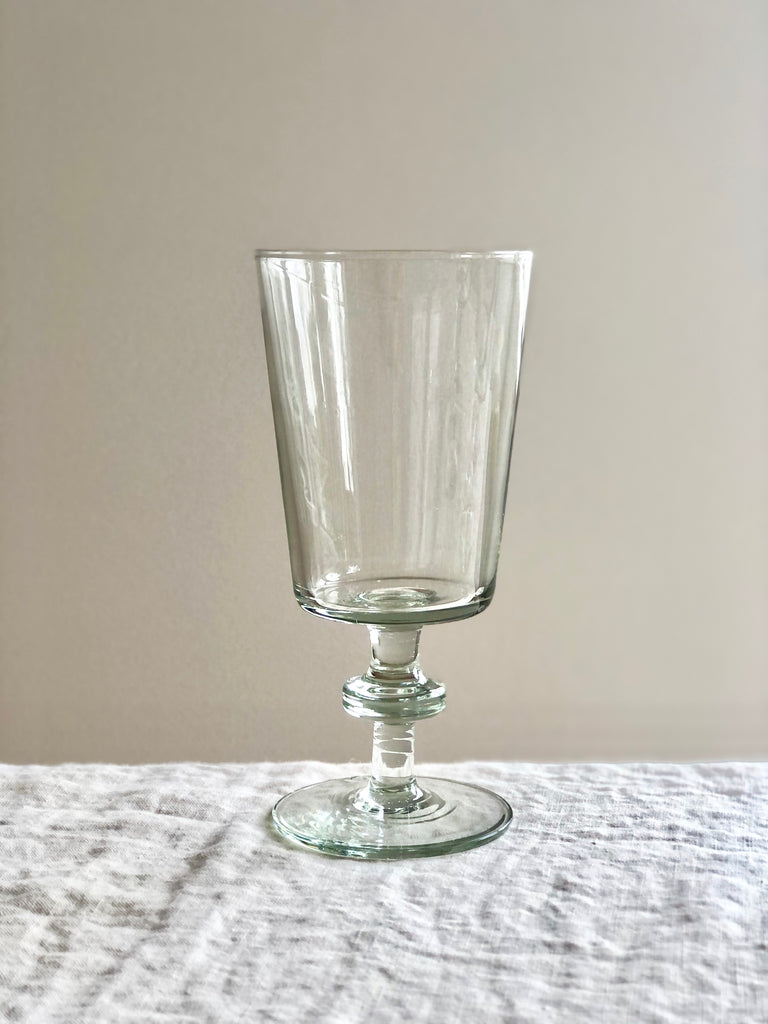 clear hand blown wine glass 6 inches tall 8 oz on table