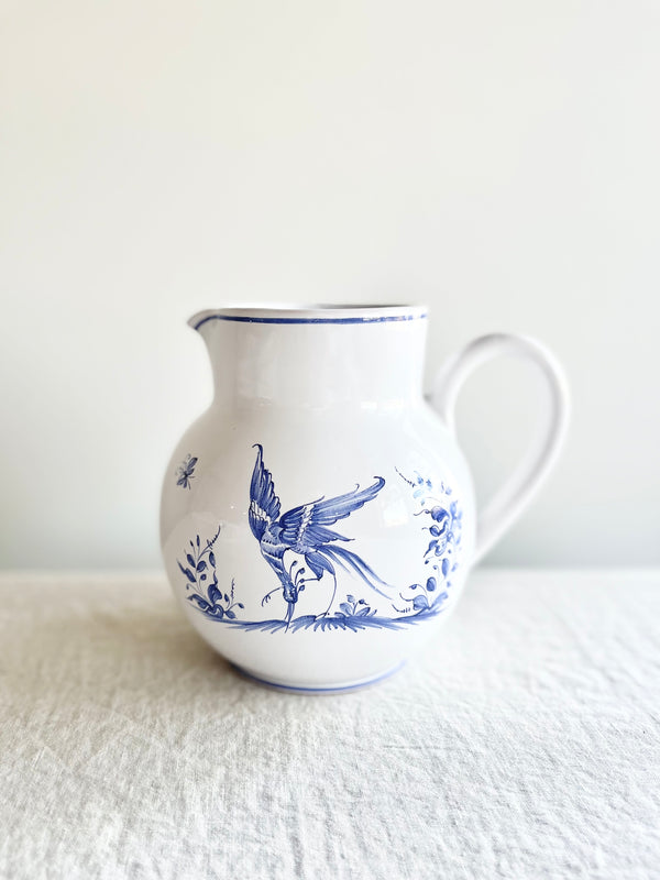 blue and white pitcher with blue phoenix design
