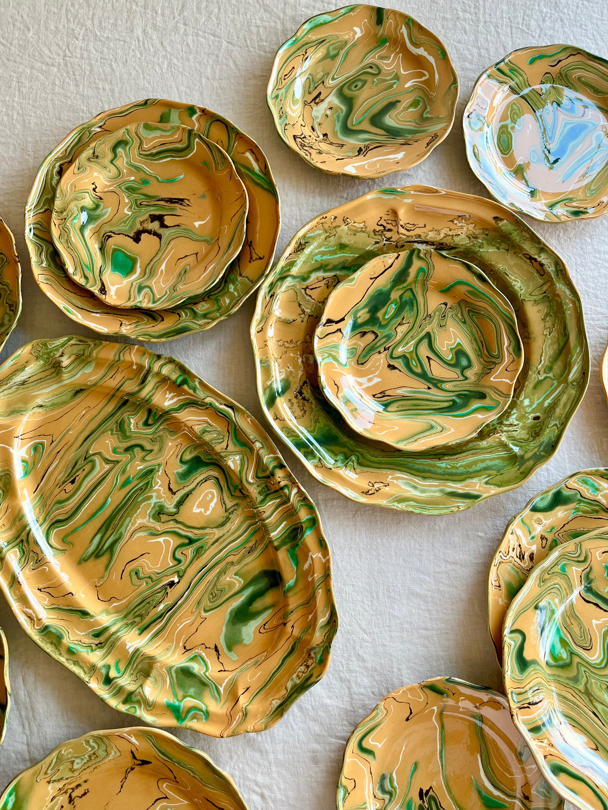 assorted Sienna Terre Mêlée Dessert Plates, scalloped plates