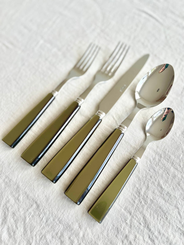sabre flatware set stainless steel icon olive on white tablecloth