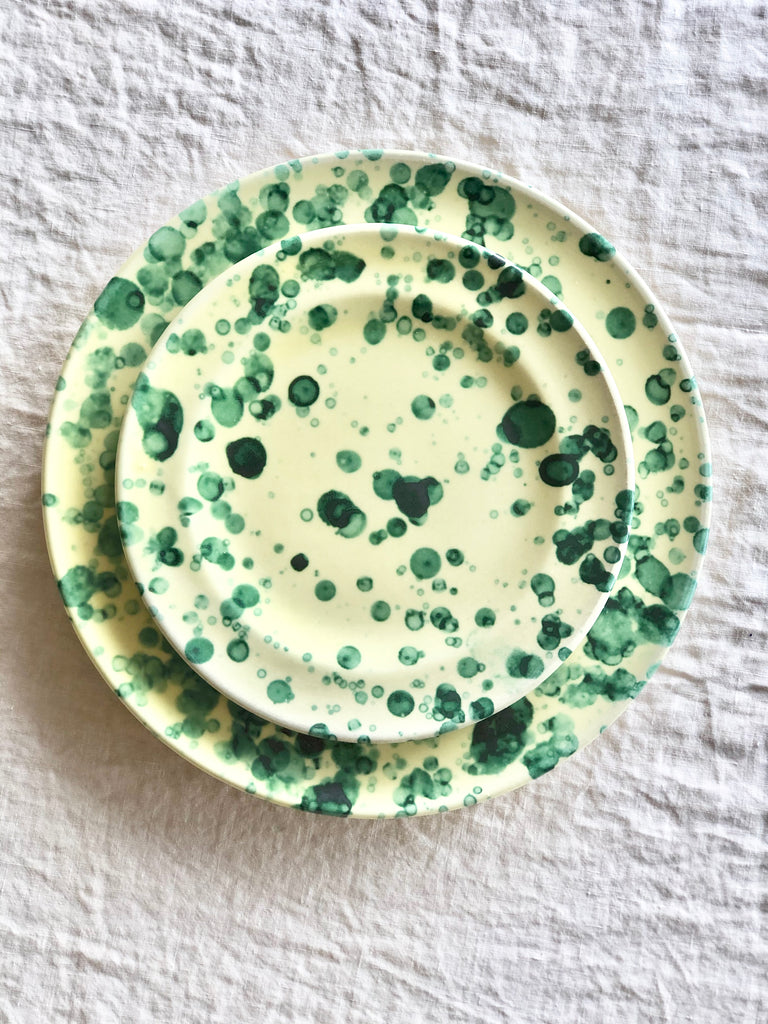 fasano dinner plate with green and cream splatter pattern with salad plate
