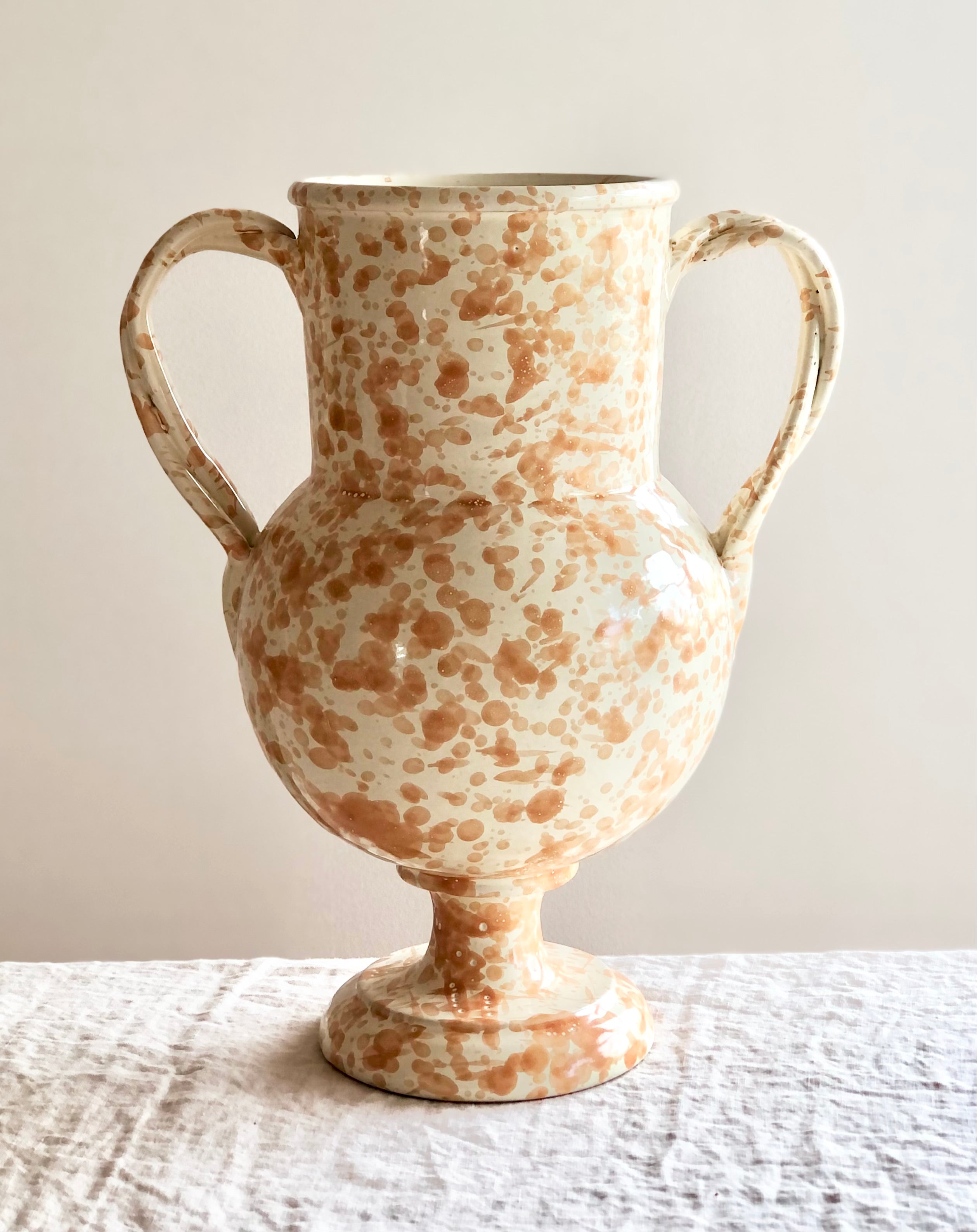 cream amphora vase with light brown speckle pattern 13 inches tall