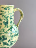 amphora vase in green and cream speckle pattern pattern detail