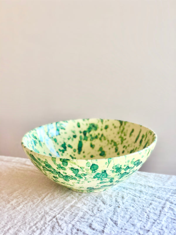 splatter pattern serving bowls in yellow and green color 13 inch side view