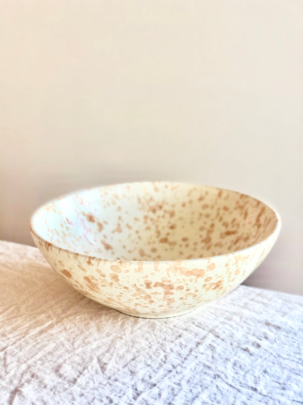 cream fasano serving bowl with light brown speckle pattern side view