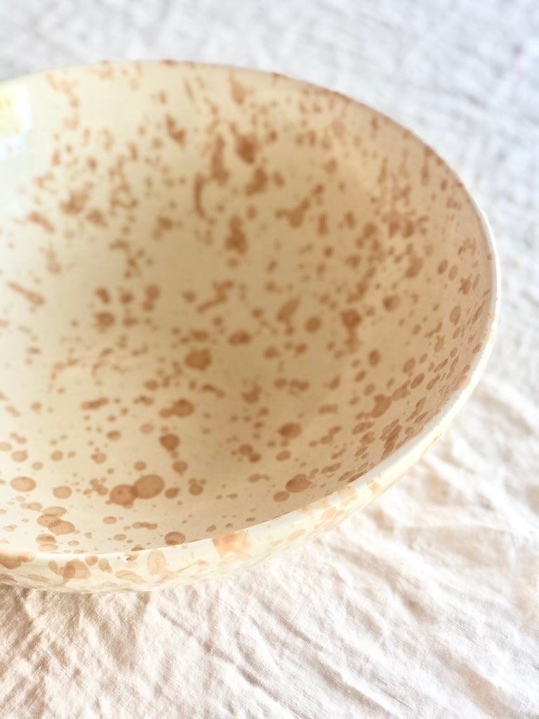 cream fasano serving bowl with light brown speckle pattern detail view