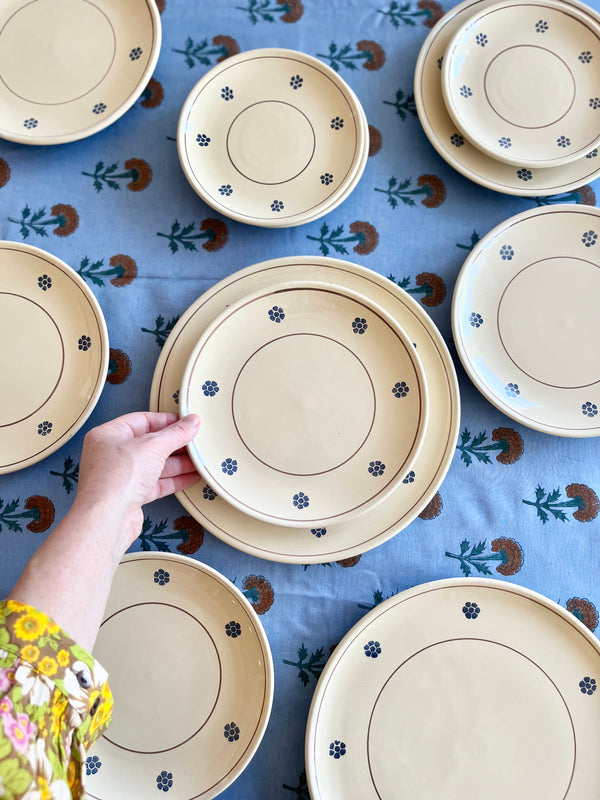 Silken Marigold Tablecloth shown with plates