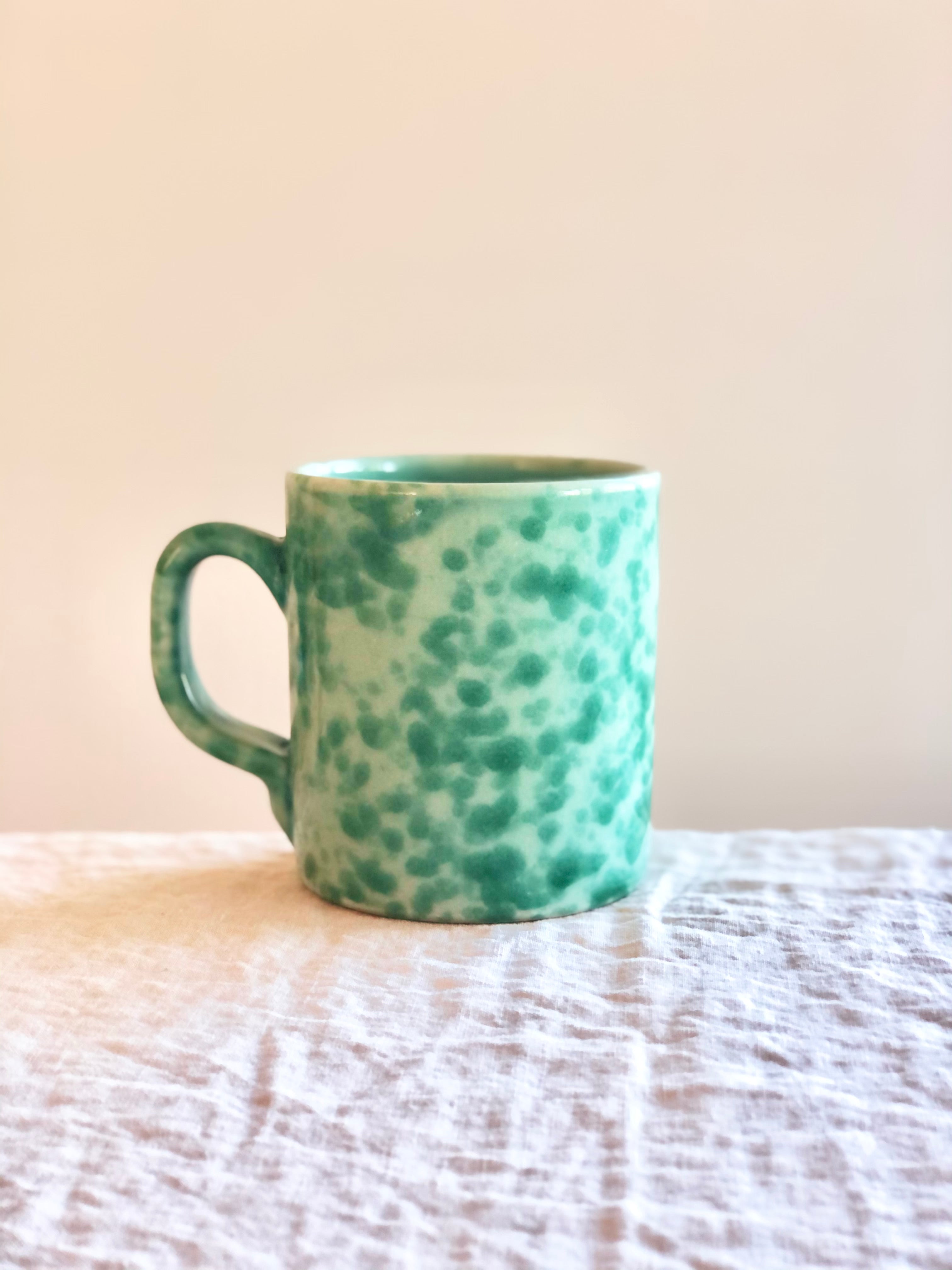 light green fasano mug with green splatter pattern