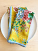 bright yellow cotton napkin with red floral print and light blue edge 20 inches square group of two