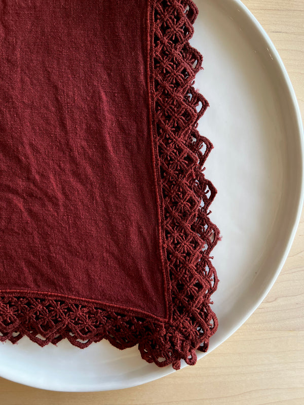 deep red linen napkins with macrame trim