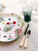 white porcelain charger plate with wildflowers with placesetting