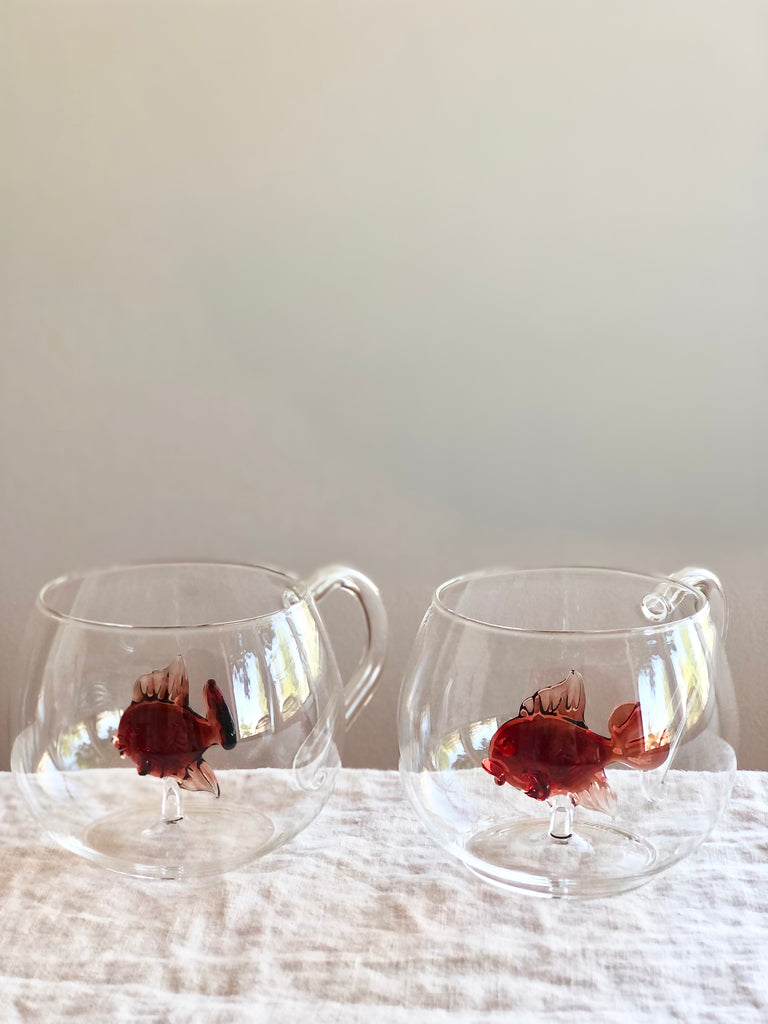 clear hand blown glass tea cups with red glass fish in bottom