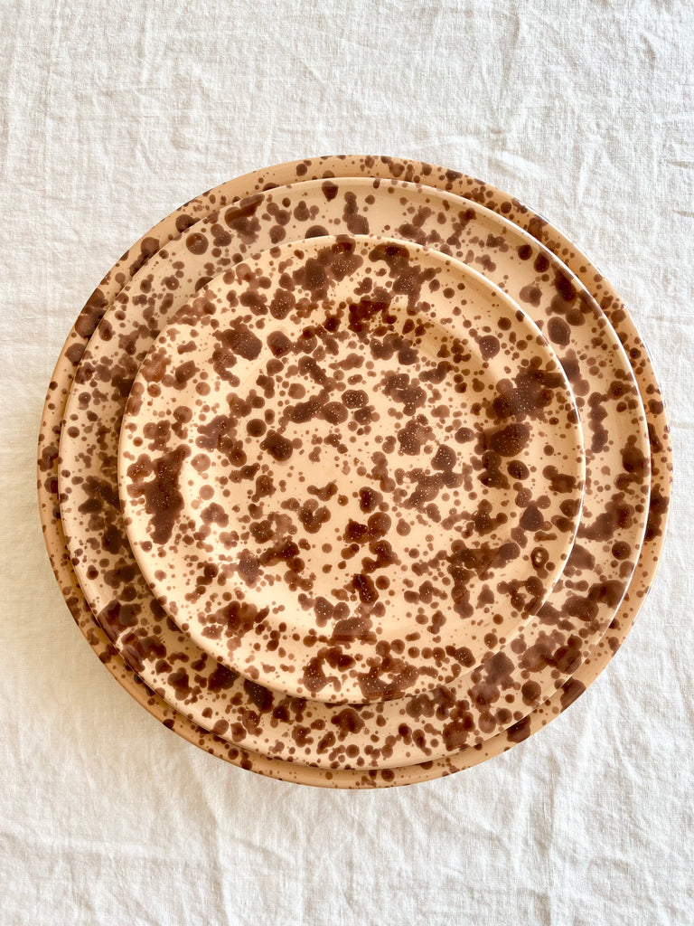 splatter pattern salad plate in brown and tan color stacked