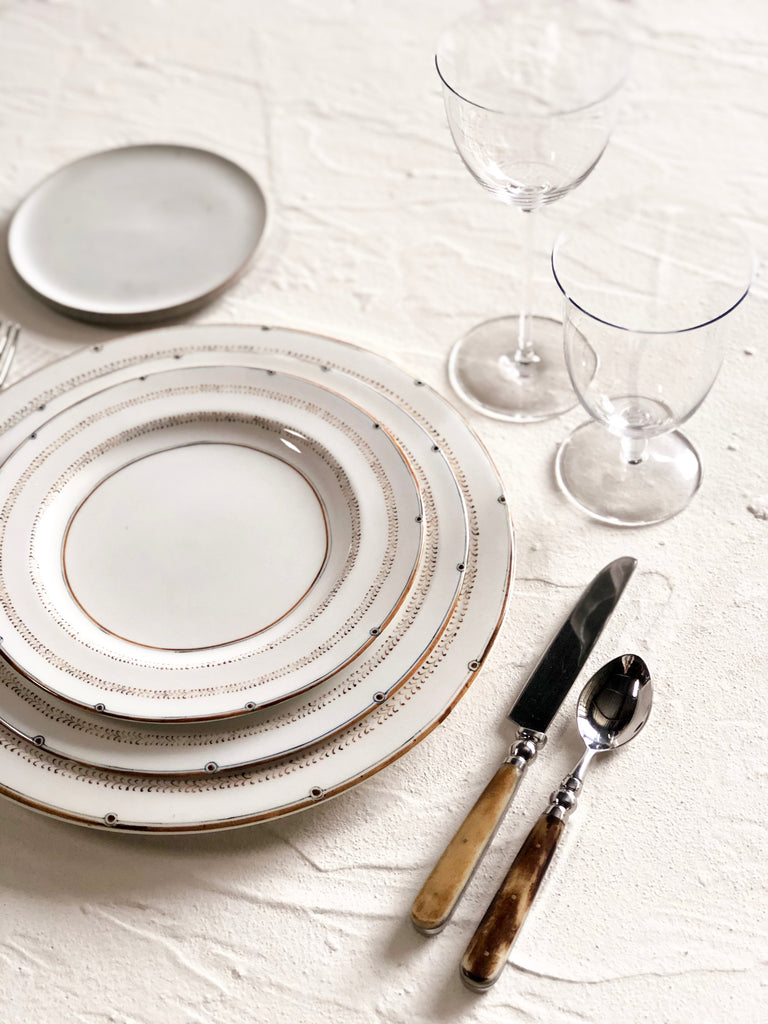 ceramic dinner plate with narrow brown brush strokes around rim with salad plate and charger plate