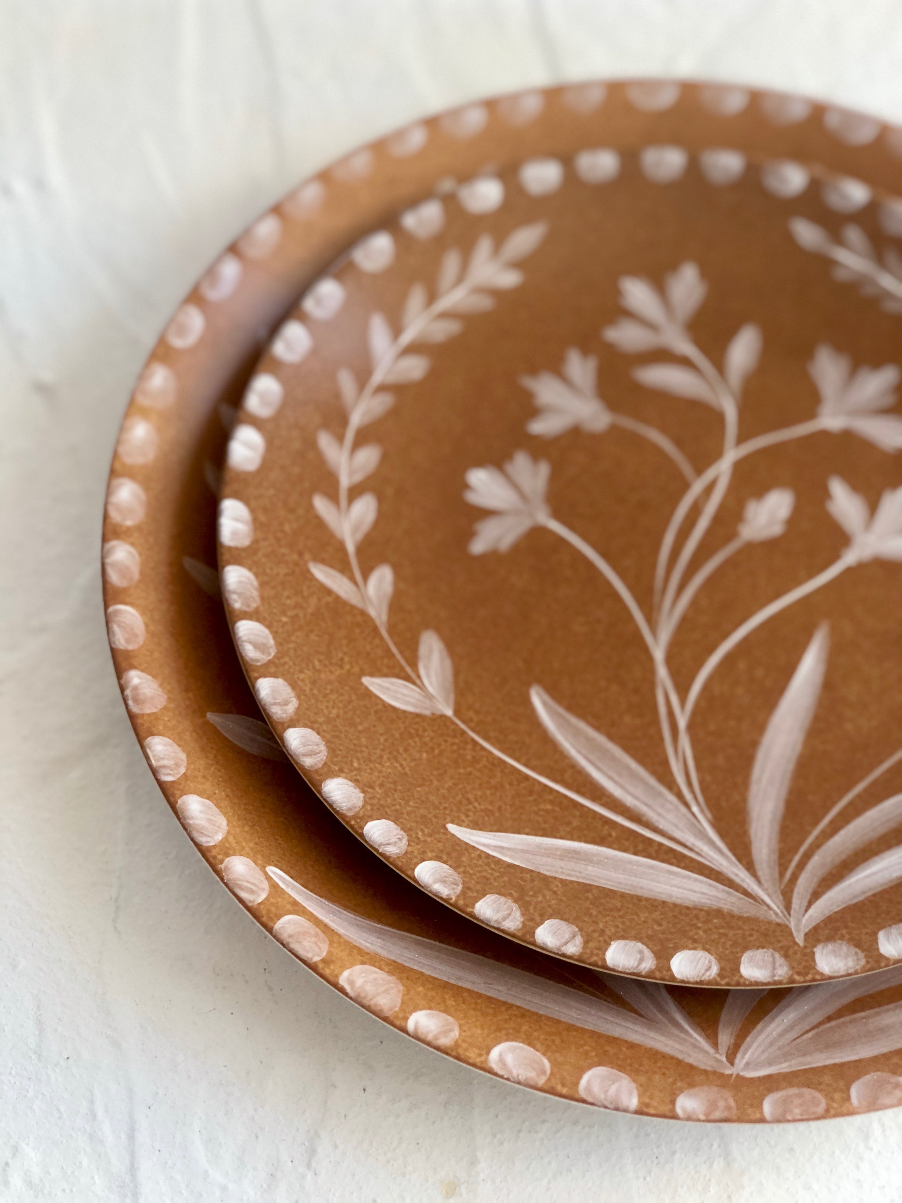 Umber toned brown salad plates close up