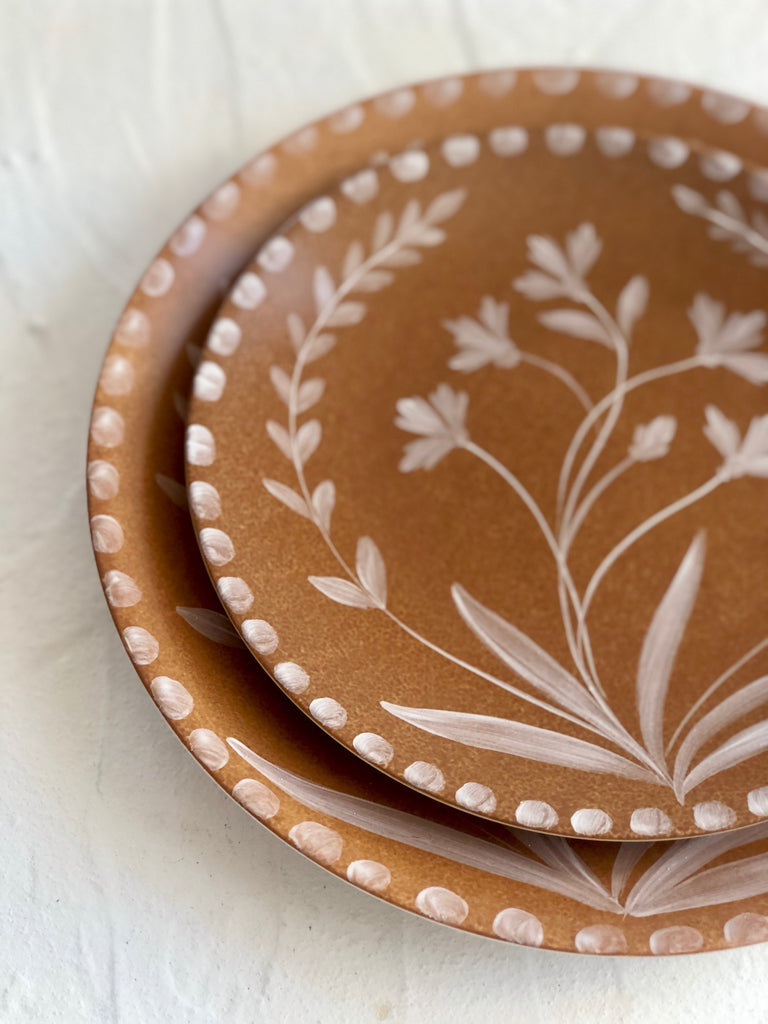 Umber toned brown dinner plates close up