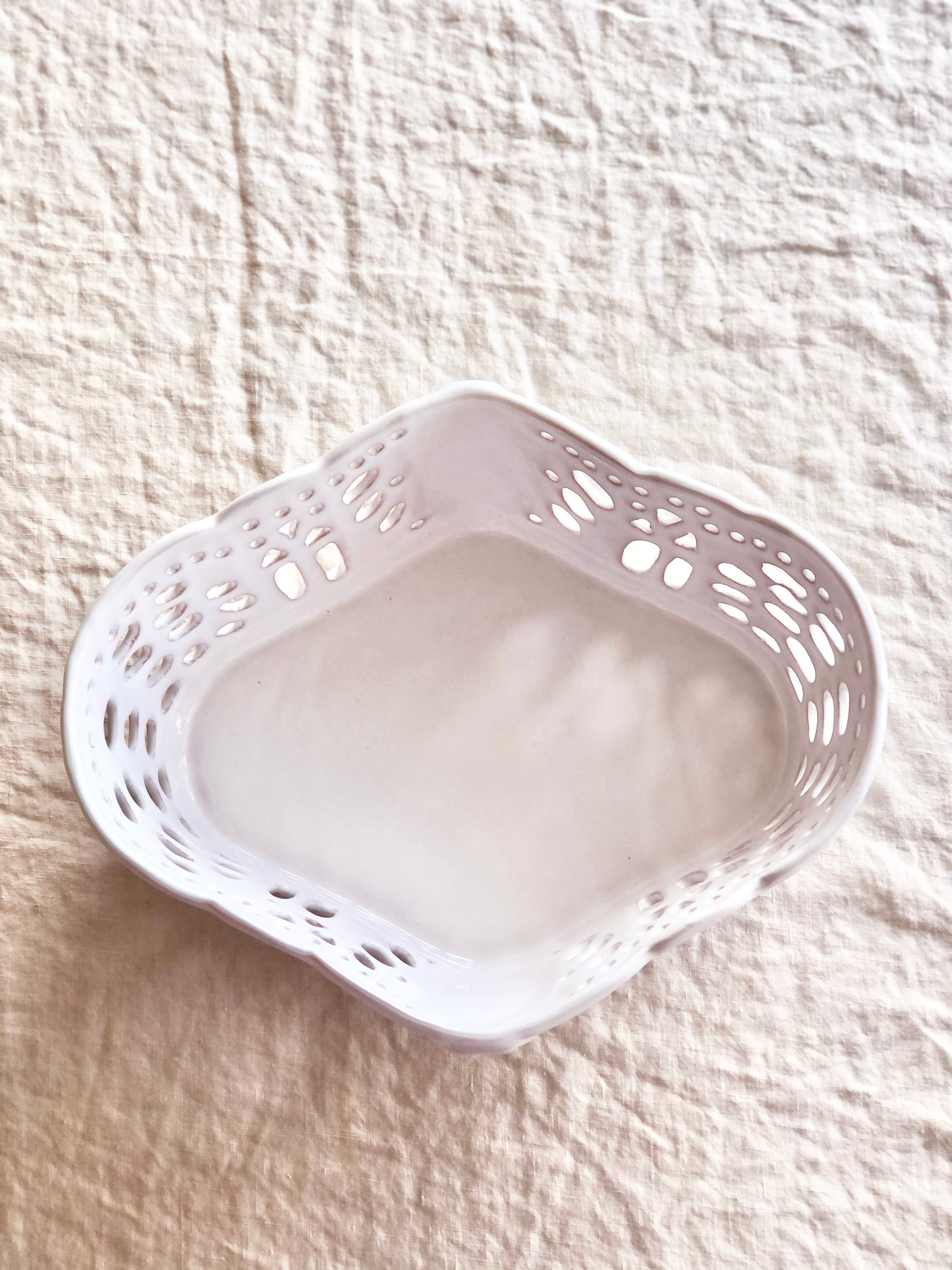 white ceramic bread basket made of french faience top view