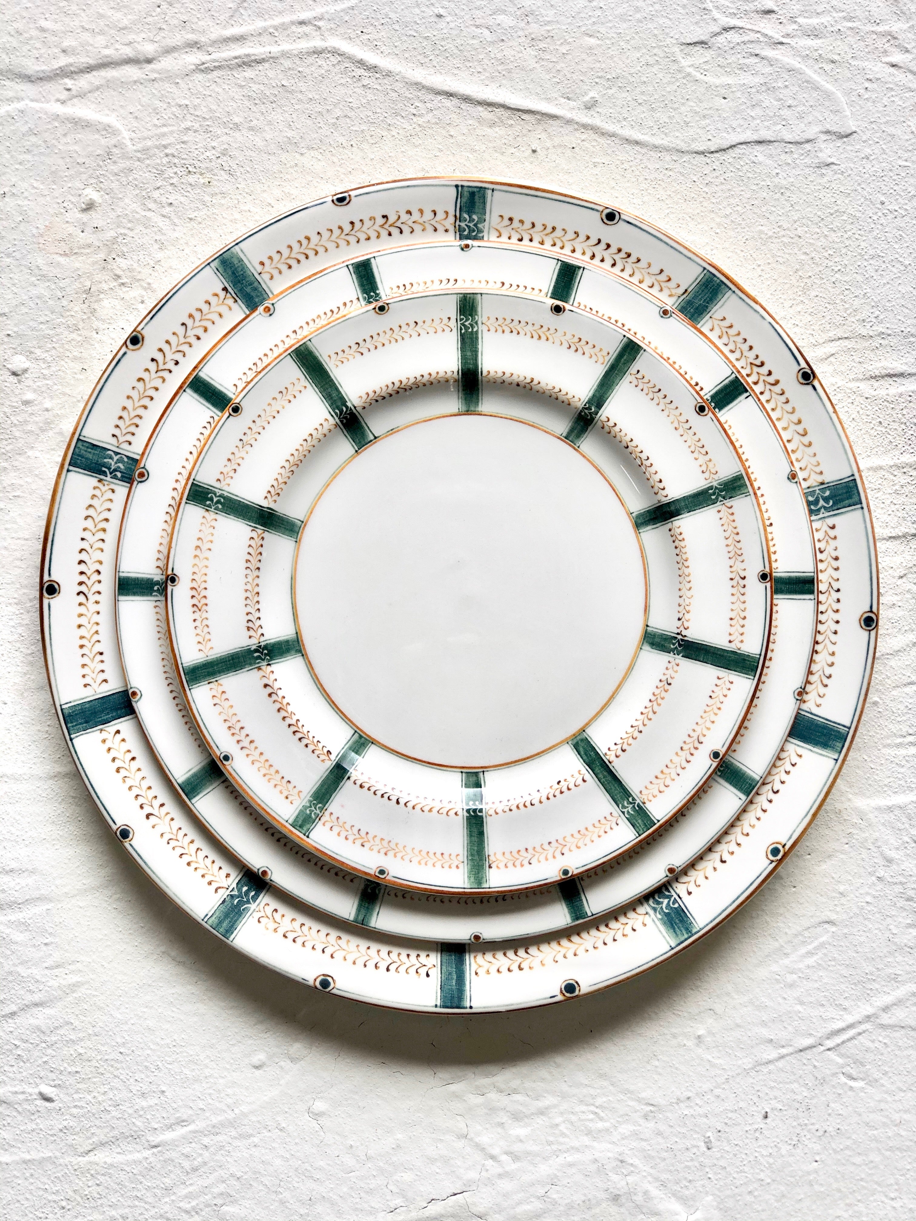 ceramic charger with teal stripes around edge 12.8 inch stacked