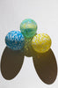 set of three hand blown glass ornaments in yellow green and blue