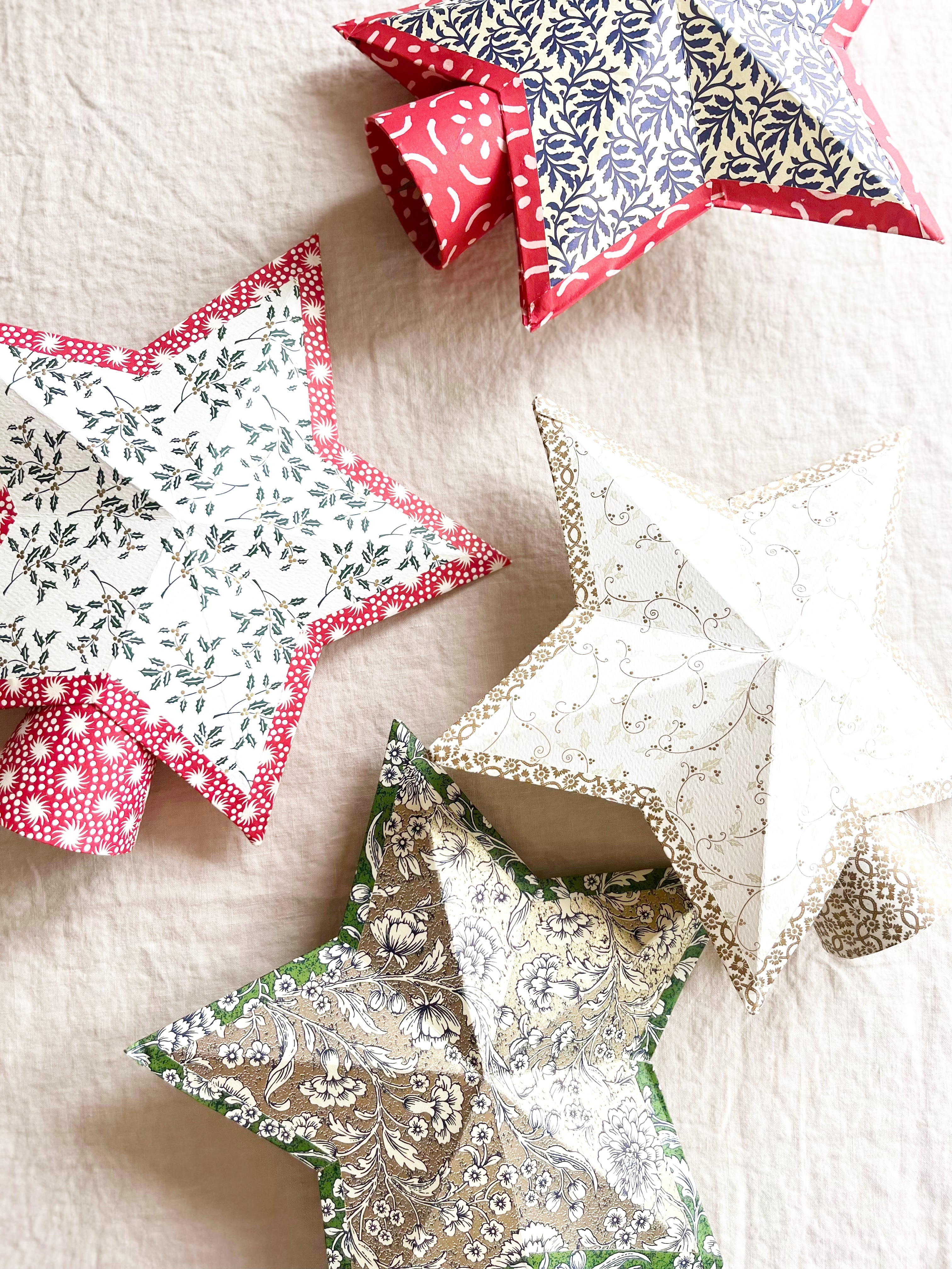 star tree topper with green swirl pattern on linen tablecloth