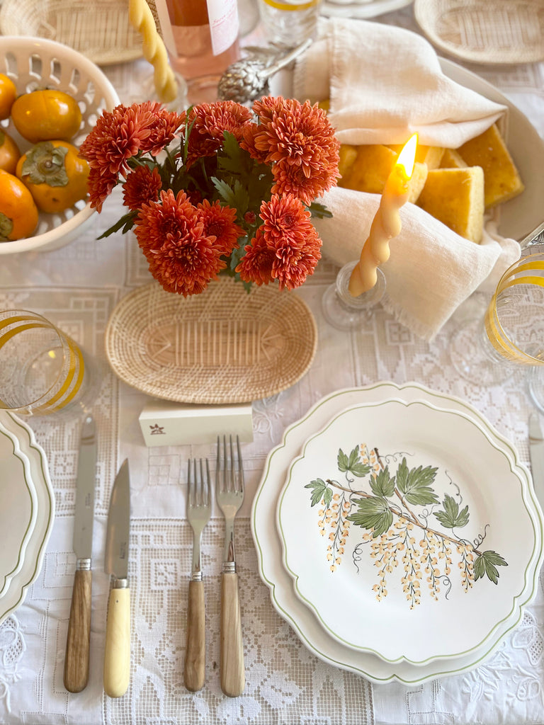 salad plate with green leaves and currants in place setting