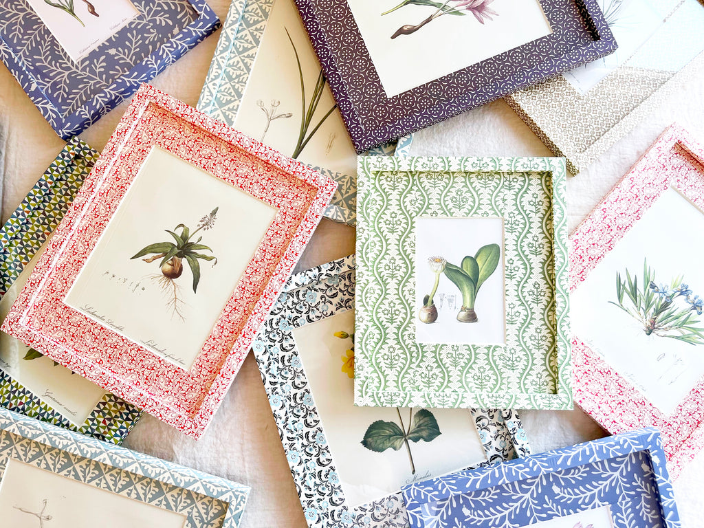 blue and white interlocking ring print paper wrapped frame and mat with pink botanical print 12" by 15" shown with other color options