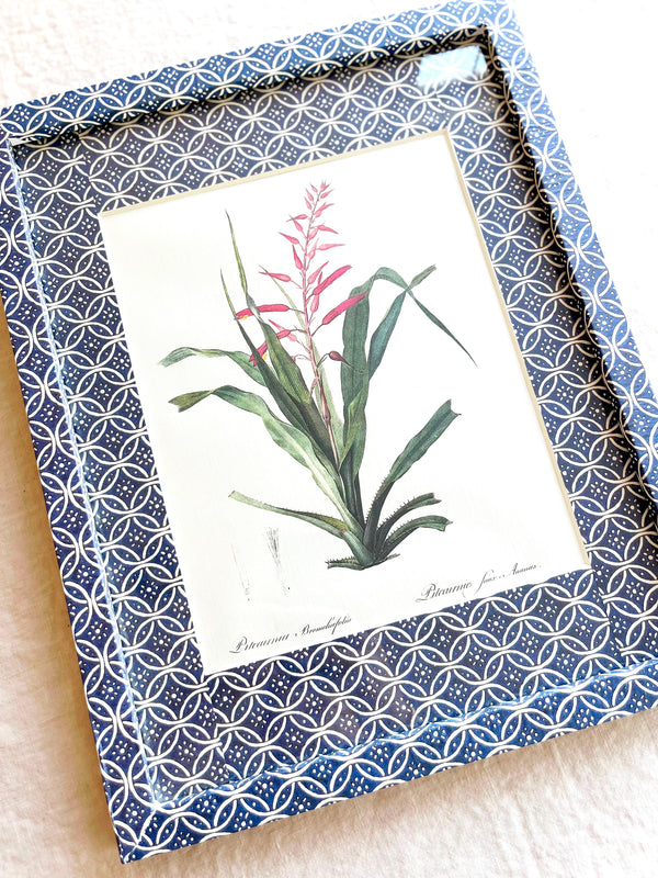 blue and white interlocking ring print paper wrapped frame and mat with pink botanical print 12" by 15" detail view