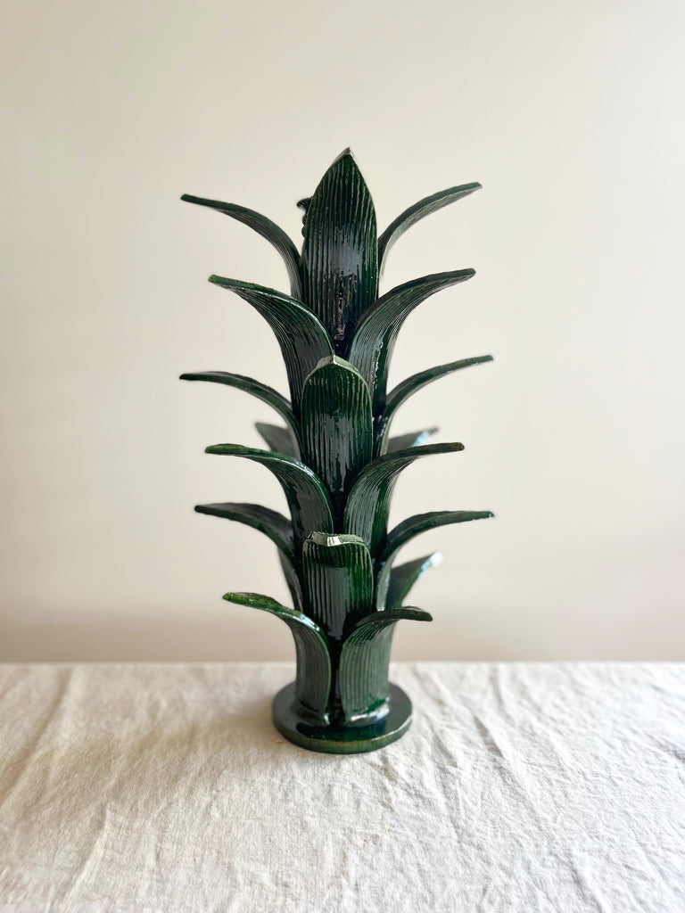 green taper candle holder shaped like the top of a pineapple 16.6 inches tall