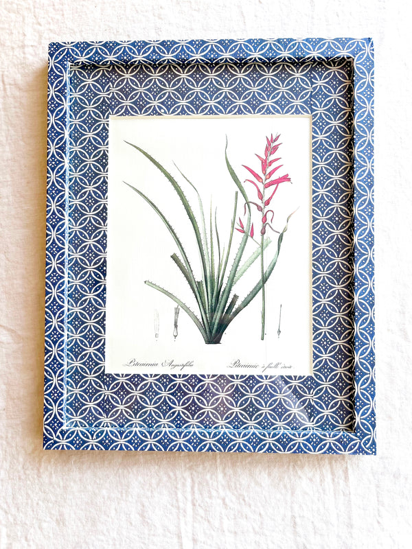 blue and white interlocking ring print paper wrapped frame and mat with pink floral botanical print 12" by 15"
