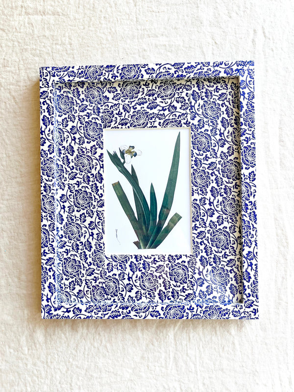 navy and white floral print paper wrapped frame and mat with white floral botanical print 11" by 13"