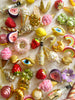 oyster and pearl glass christmas ornament on white linen tablecloth