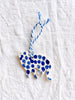 hand painted blue and white cat christmas ornament with blue striped ribbon