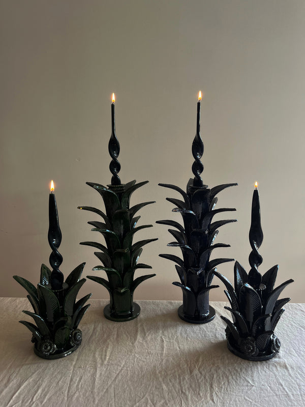 green taper candle holder shaped like the top of a pineapple 16.6 inches tall shown with other size options