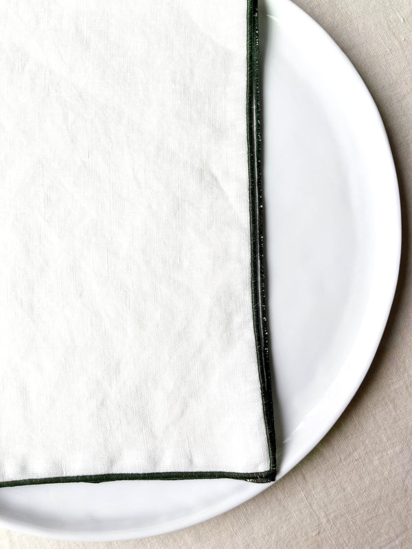 white rolled edge linen napkins with forest green edge 18 inch square