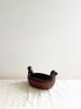 brown clay bowl with dove heads on opposite sides angled view