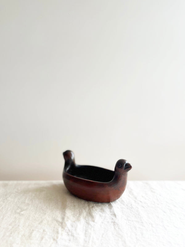Dark color dove shaped bowl angled view