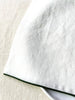 white rolled edge linen napkins with forest green edge 18 inch square edge detail view