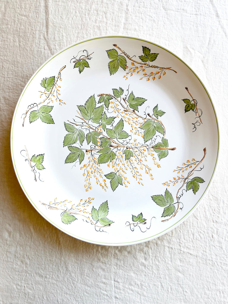 serving platter with green leaves and currants