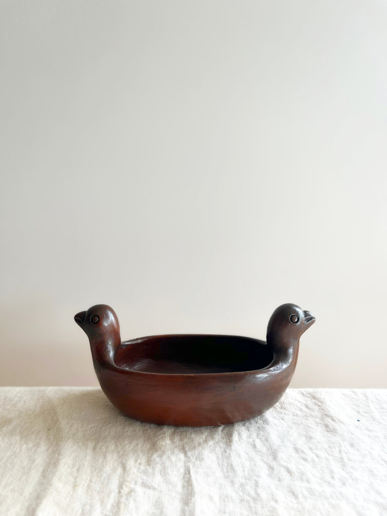 Dark color dove shaped bowl side view