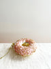 pink donut with gold sprinkles glass christmas ornament side view