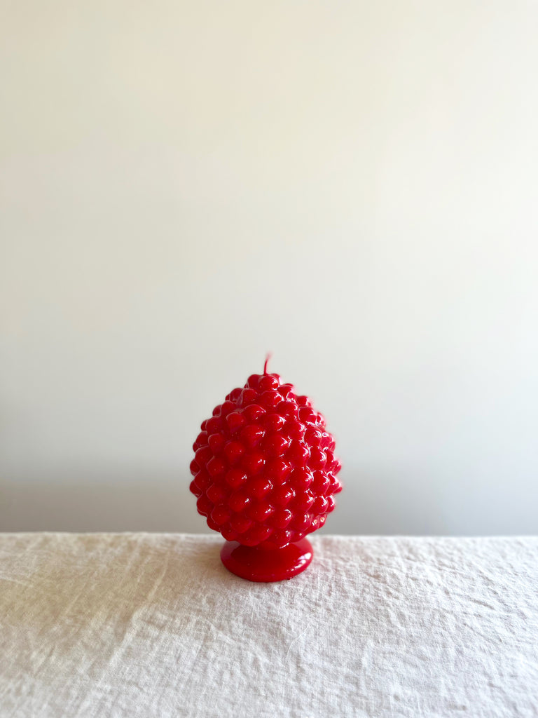 cereria introna pinecone paraffin wax candle red on white linen