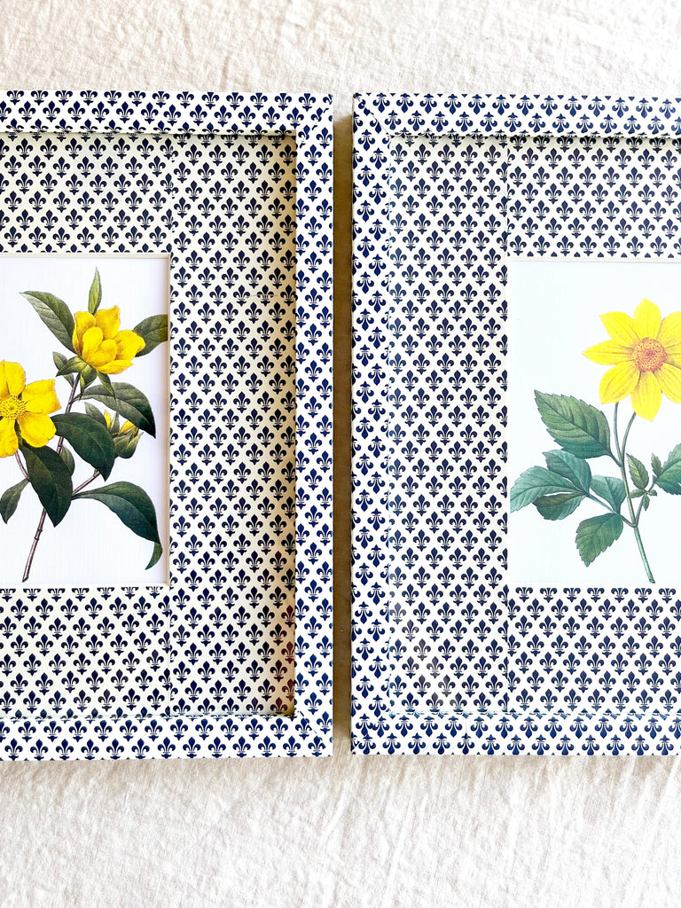 navy and white fleur de lys print paper wrapped frame and mat with yellow daisy botanical print 11" by 13" group of two