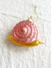 pink and gold snail glass christmas ornament detail view