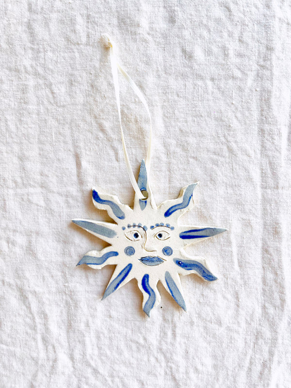 hand painted blue and white star christmas ornaments on white table