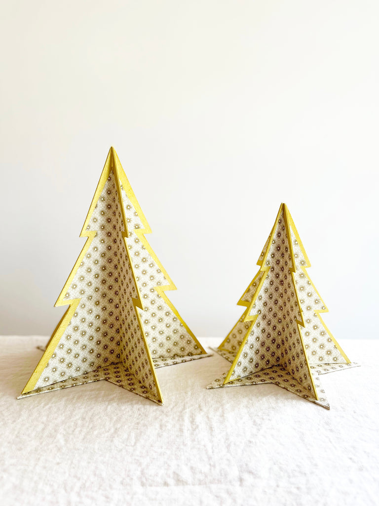 decorative paper Christmas tree stands with gold sun pattern shown in two sizes