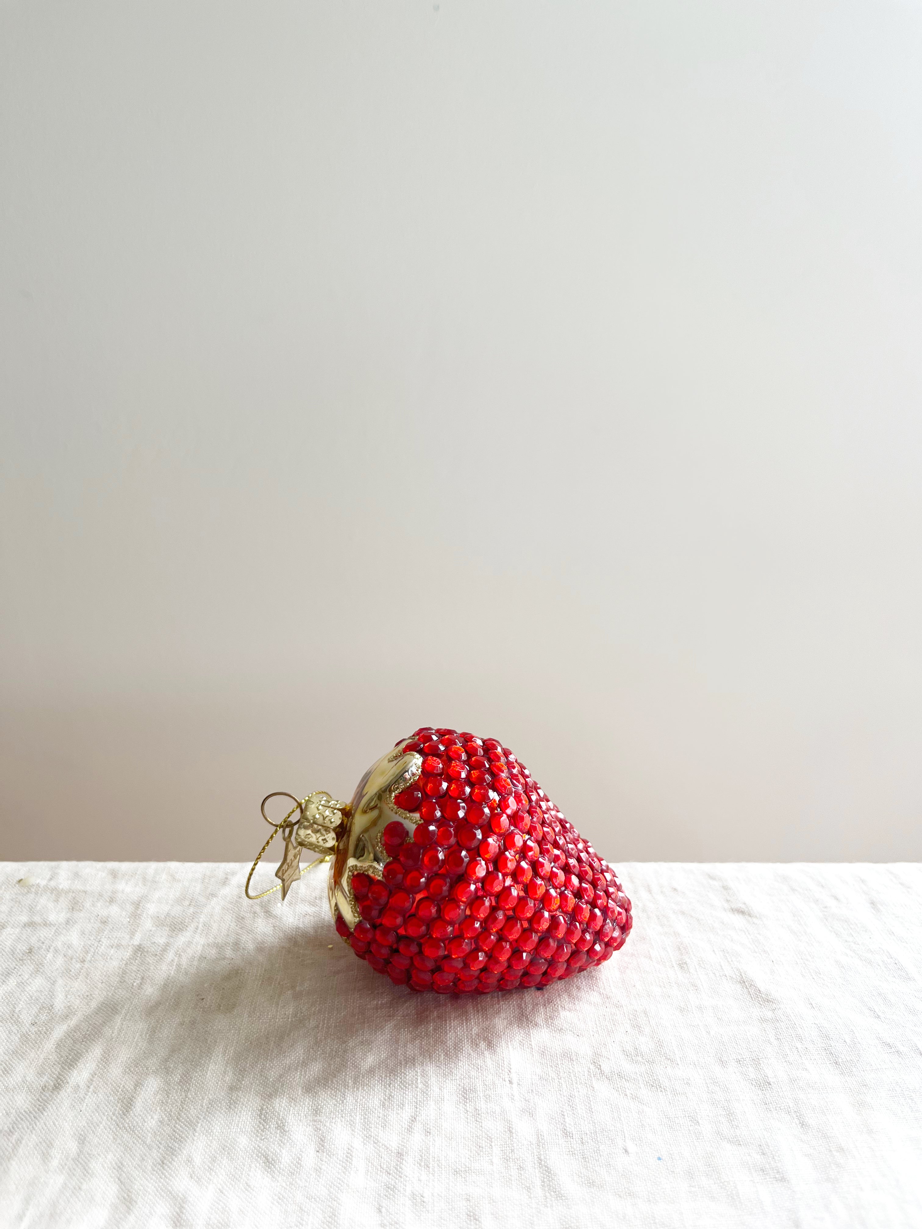 sparkly red srawberry glass christmas ornament side view