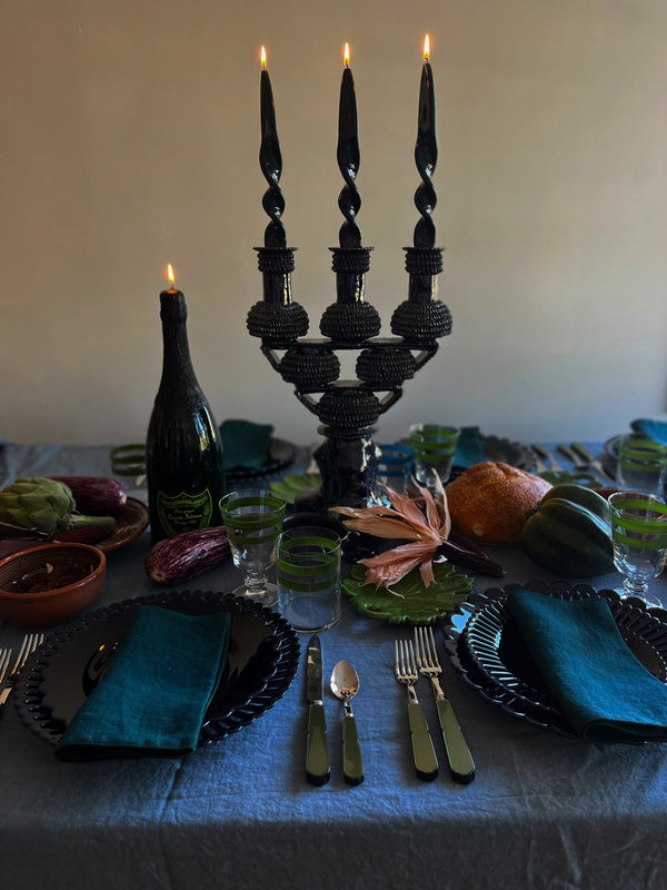 blue ceramic candelabra 17.5 inch on table setting with flame lit