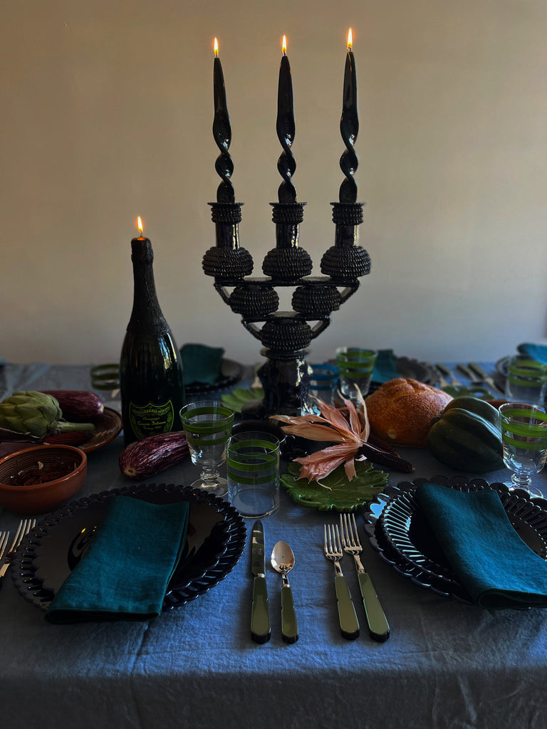 blue ceramic candelabra 17.5 inch on table setting with flame lit