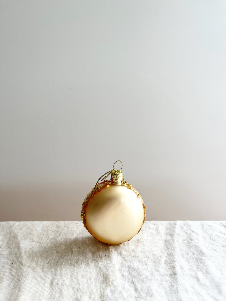gold macaroon glass christmas ornament with ribbon